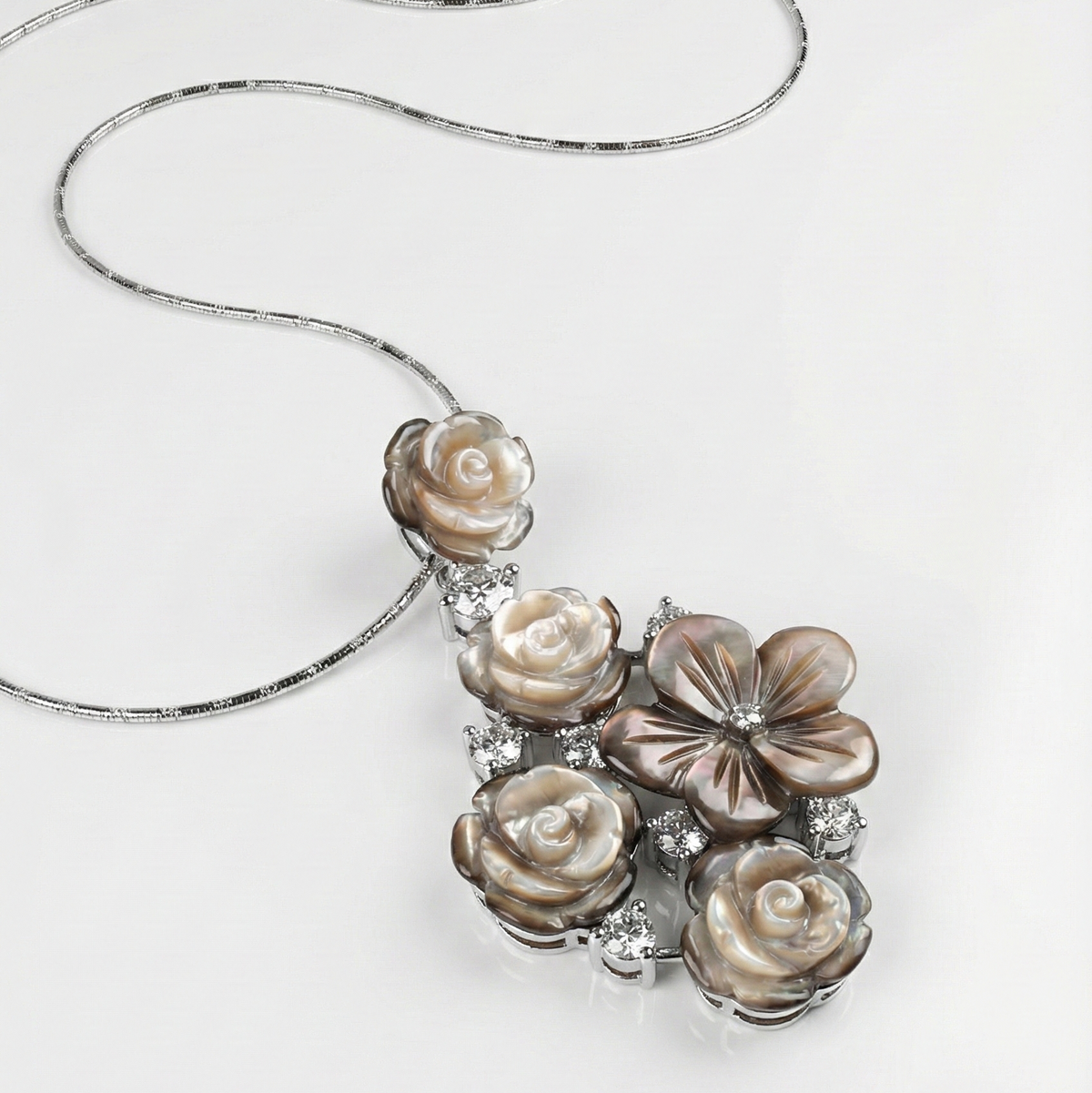 Necklace with floral pendant on a white background