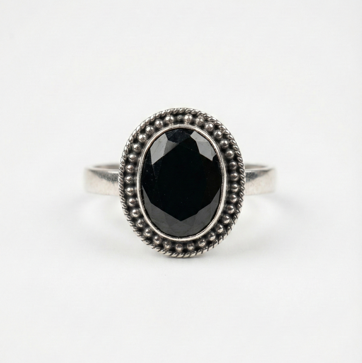 Midnight oval halo ring