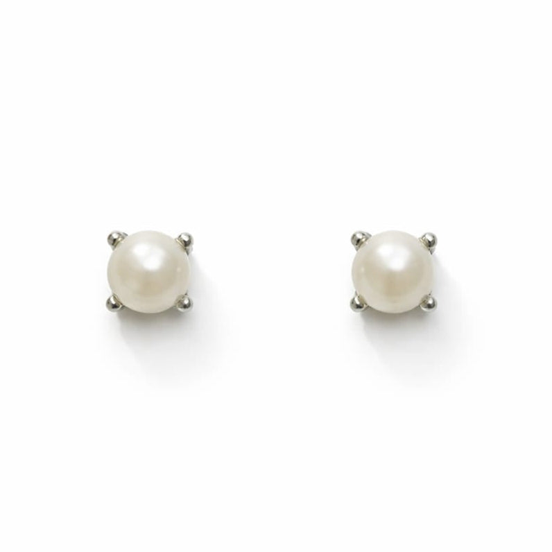 Pair of pearl stud earrings on a white background