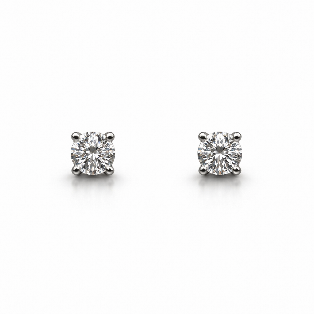 Pair of diamond stud earrings on a white background