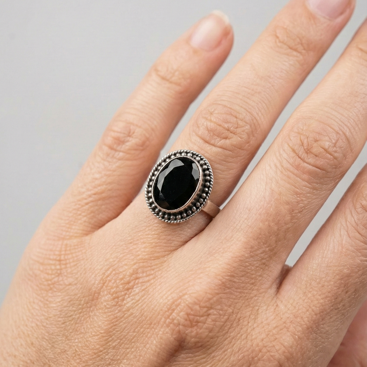Midnight oval halo ring