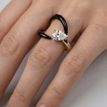 Load image into Gallery viewer, Hand wearing a diamond ring on a plain background
